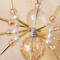 Artisan-crafted gold and pearl beaded spider ornament with delicate wire legs, faceted gemstone-style beads, and warm shimmering accents.